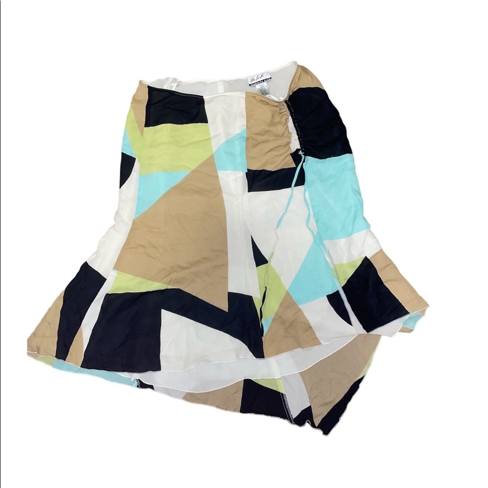 The cutest y2k flowy skirt with ruched slit.